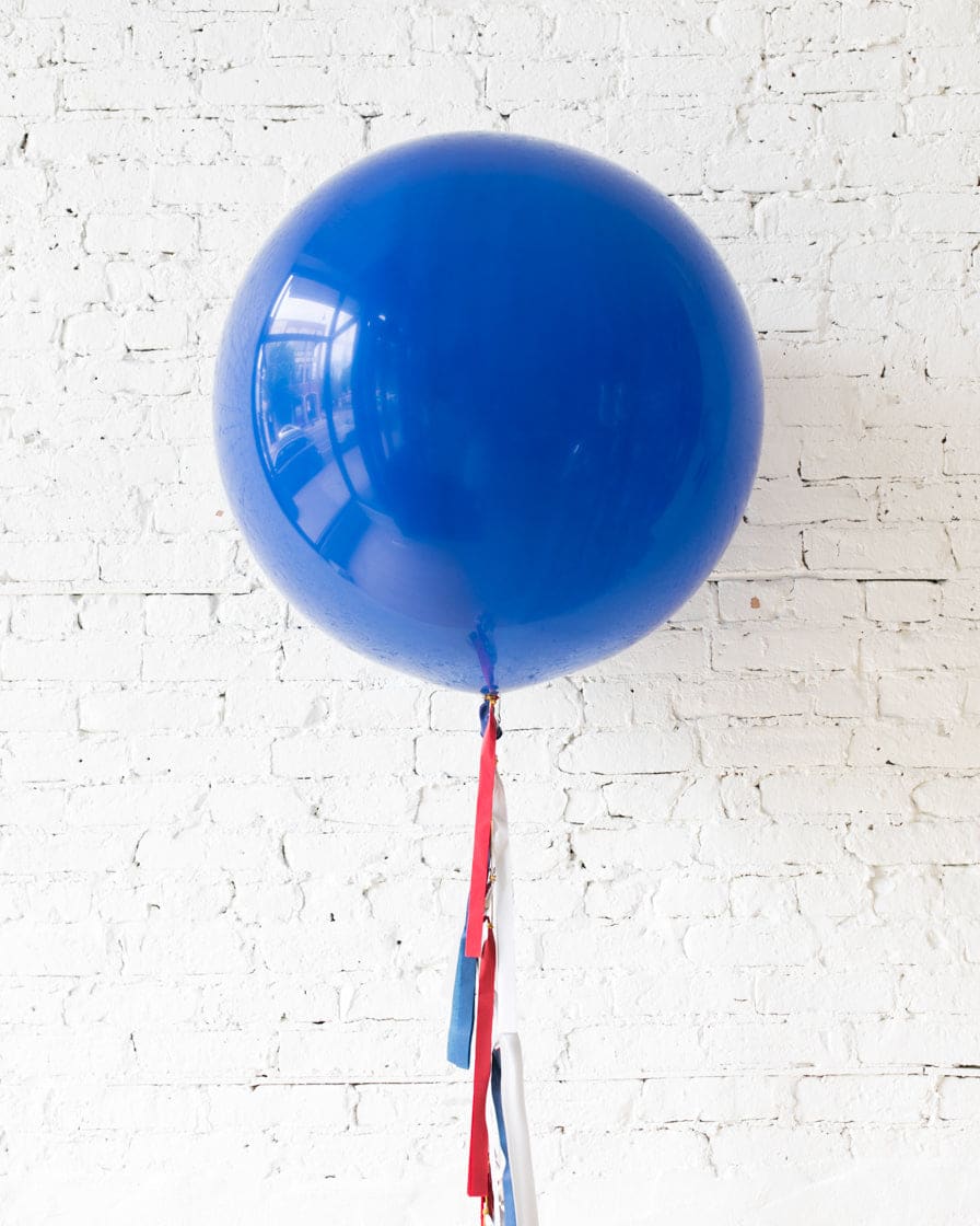 Dark Blue Giant Balloon and Red, White & Blue Palette Tassel | Rental