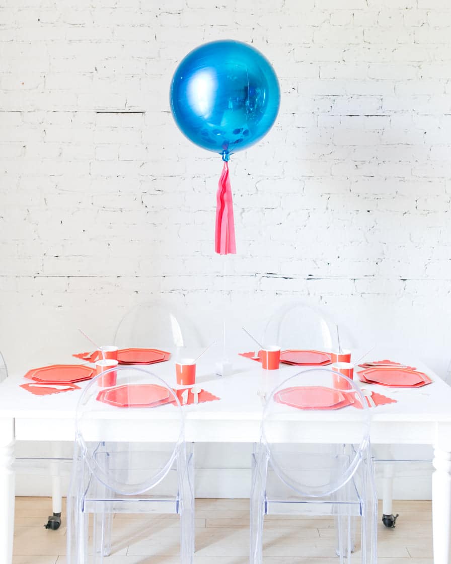 16in Blue Orb Foil Balloon and Red Skirt Centerpiece | Rental
