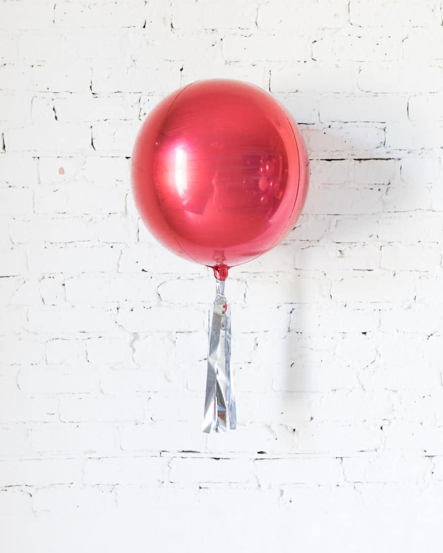 16in Red Orb Foil Balloon and Silver Skirt | Rental